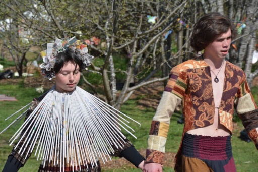Kindlehill students wearing award-winning recycled outfits celebrate creative imagination, social responsibility, and deep connection with nature.