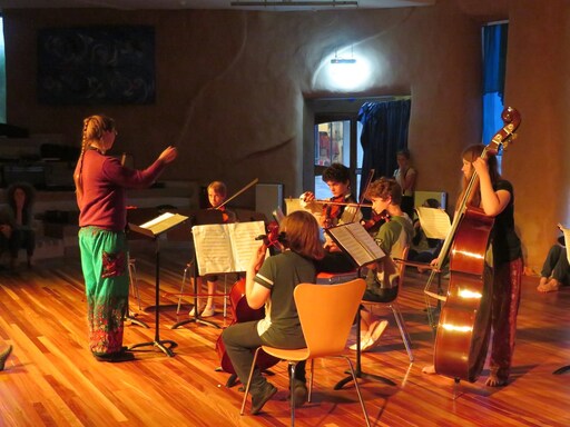 Kindlehill students harmonise in a musical ensemble, showcasing artistic expression and community spirit during the Summer Soiree.
