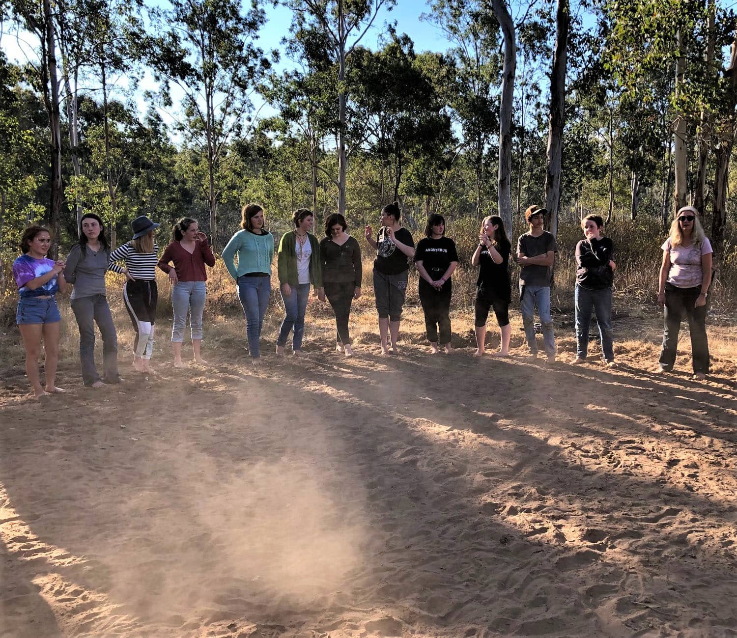 Kindlehill students stand barefoot on Country, honouring culture and history through community dance at Yellomundee.