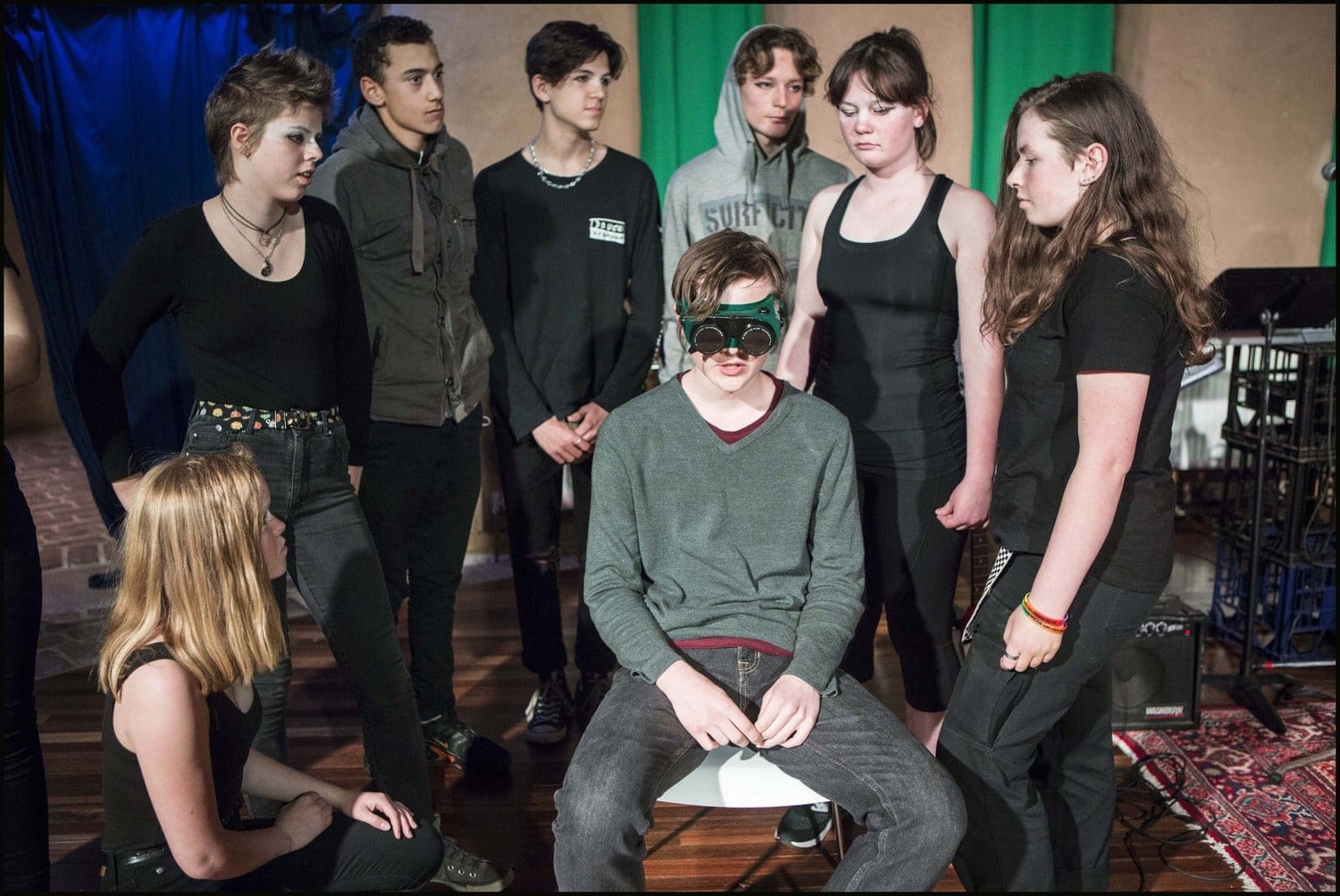 Courageous teenagers perform the Bestest World musical, exploring environmental activism and a dystopian future through artistic collaboration.