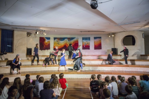 Kindlehill students perform Romeo and Juliet, fostering community connection through creative storytelling and vibrant artistic expression.