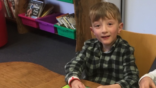 A student experiences warmth and a sense of belonging in the library during Kindlehill After School Care.