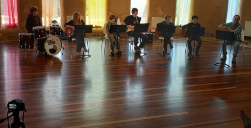 The Kindlehill jazz ensemble performs together, embodying artistic expression, community connection, and shared purpose through collaborative music.