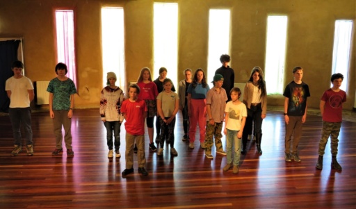 Students express empathy and social justice through a poignant movement performance depicting the shared refugee journey.