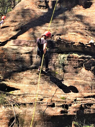 A Kindlehill student abseils sandstone cliffs at Mt Victoria, building personal challenge and resilience through connection to Country.