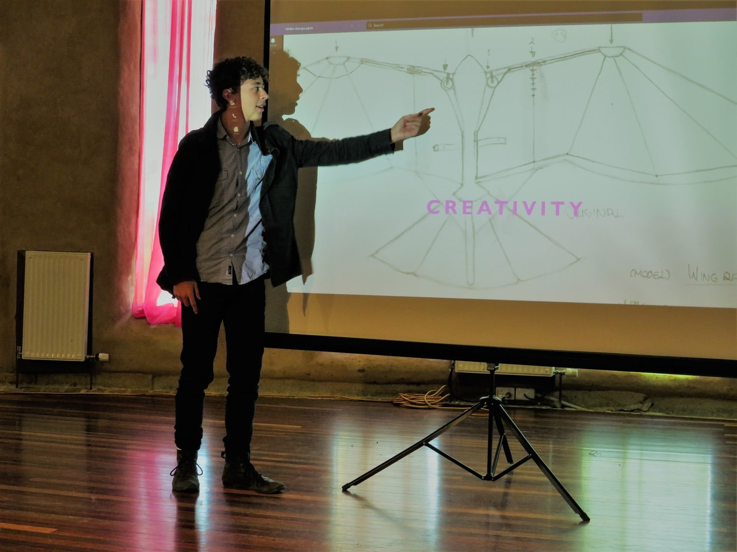 A student shares his creative project, demonstrating empowered learning and the transformation of imagination into purposeful action.