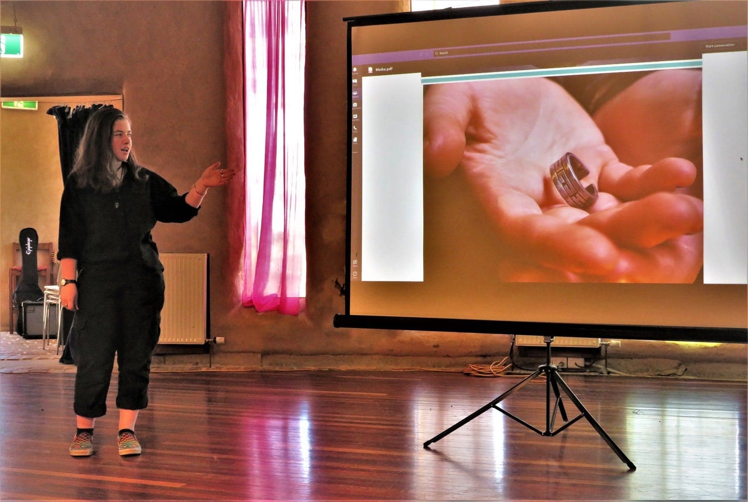 Confident student presents her handcrafted major project, honouring individual growth and the artistic connection between head, heart, and hands.