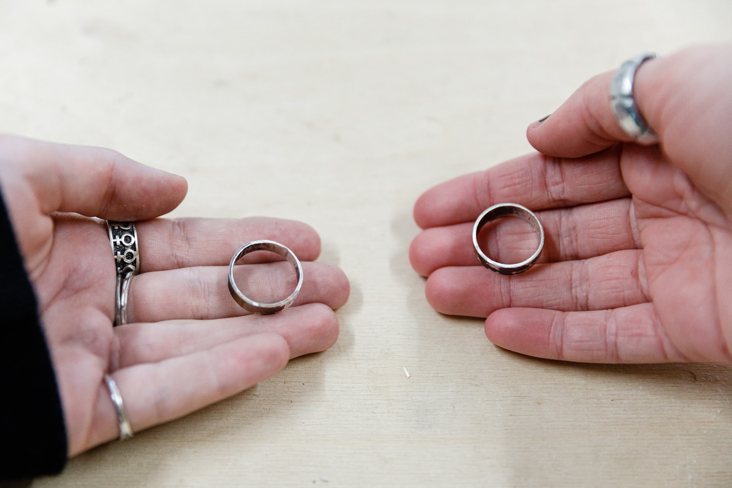 Hands display handcrafted sterling silver rings, symbolising student connection and artistic expression through Kindlehill metalwork.