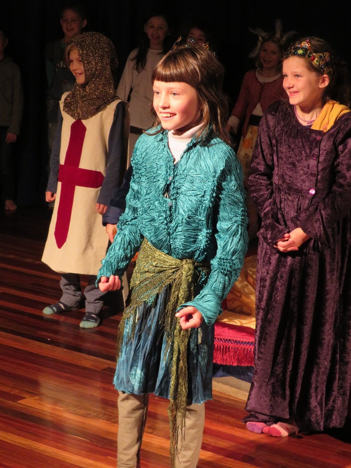 Class 2-3 students radiate confidence while performing The Punctuation Players, showcasing artistic expression and Kindlehills vibrant community spirit.