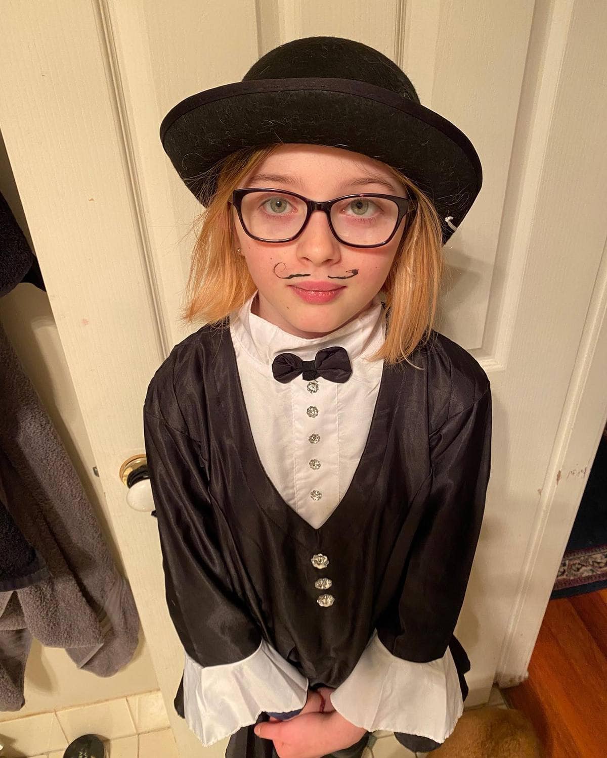 A Kindlehill student showcases creative imagination dressed in a tuxedo for the schools Tiny Film Festival premiere.