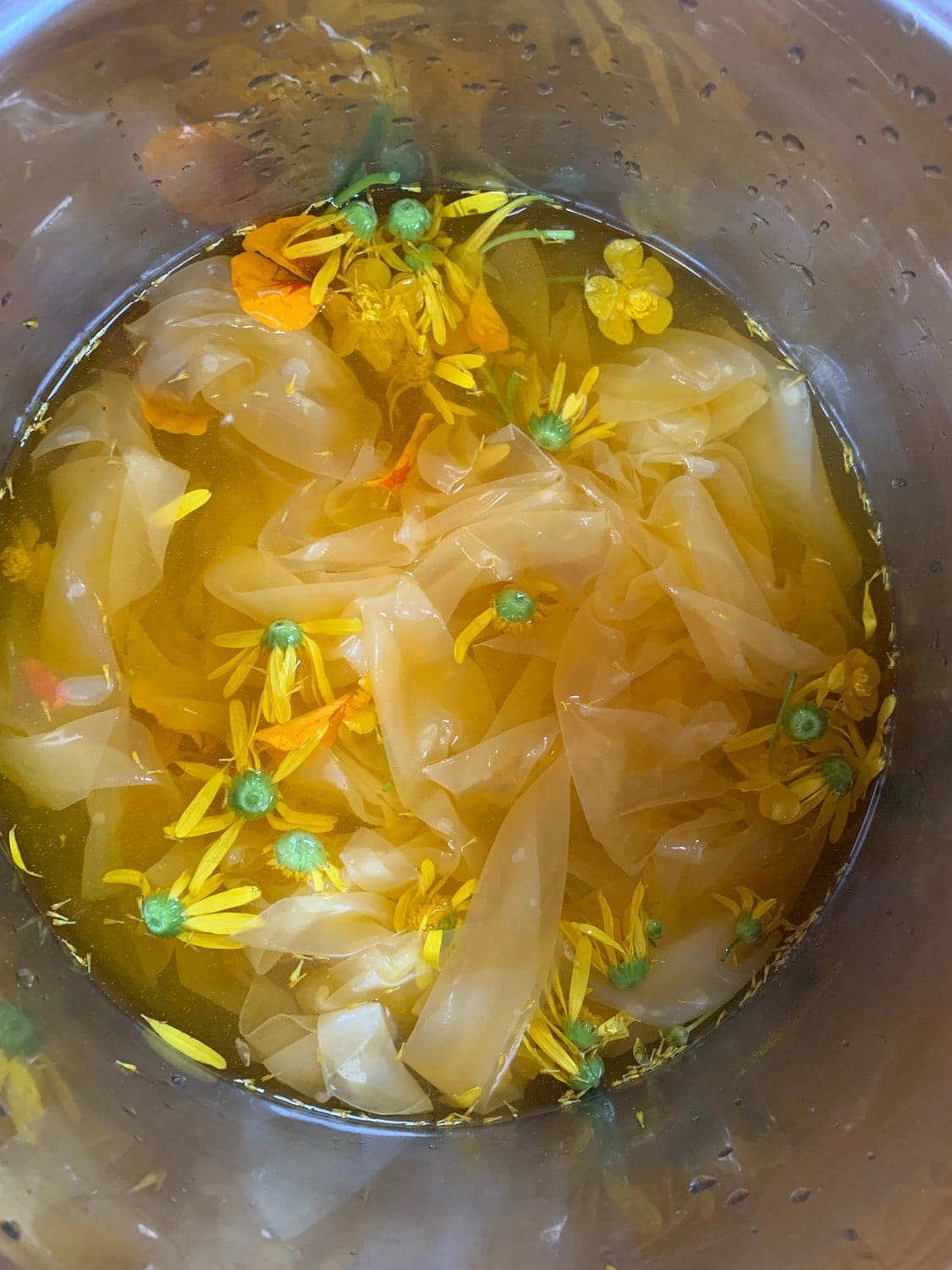 Golden silk soaking with yellow blossoms, honouring ancient stories and connecting children to the beauty of natural transformation.