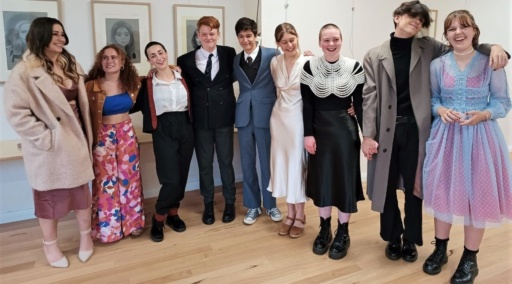 Kindlehill graduates stand with arms linked, celebrating their unique growth, shared purpose, and a deep sense of belonging.