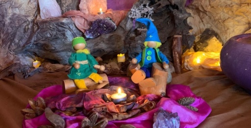 Handcrafted winter beings huddle amongst crystals and silks, honouring the seasonal search for inner light and community warmth.