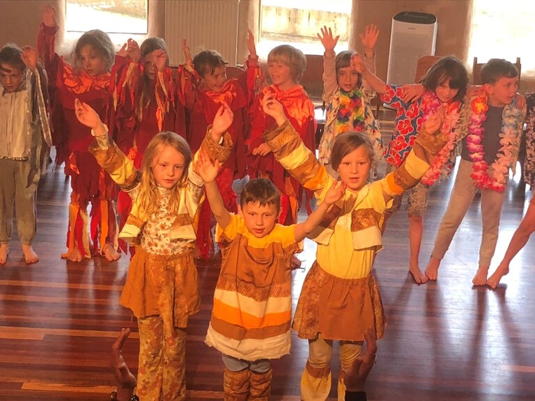 Kindlehill students personify the rock cycle through expressive movements and vibrant costumes during an earth-centred geology play.