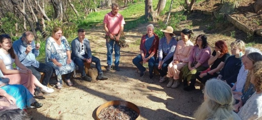 Community members gathered in a bushland fire circle, building a shared vision through connection and an Acknowledgement of Country.