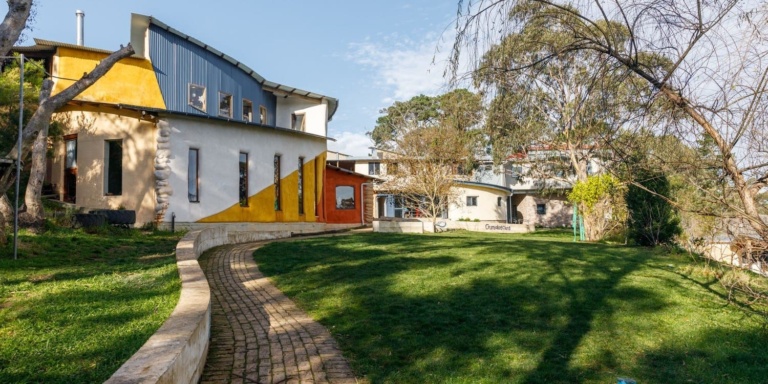 Earth-centred Kindlehill architecture nestled in native gardens provides a sanctuary for place-based learning and community sustainability initiatives.