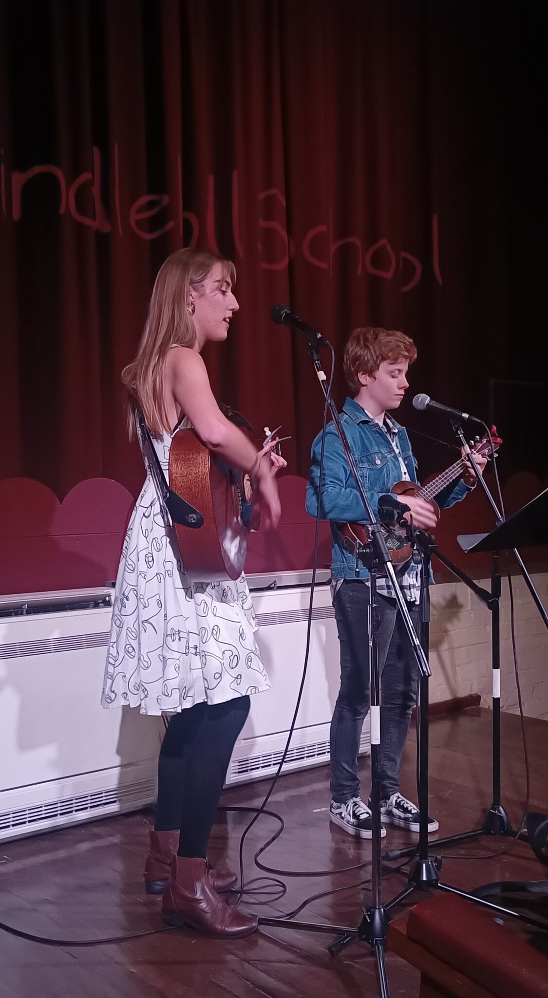 Kindlehill alumni and students perform together, honouring community through song and creative expression.