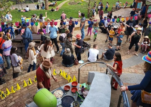Kindlehill School families gather in a colourful courtyard to celebrate the vibrant spirit of community and connection on Country.