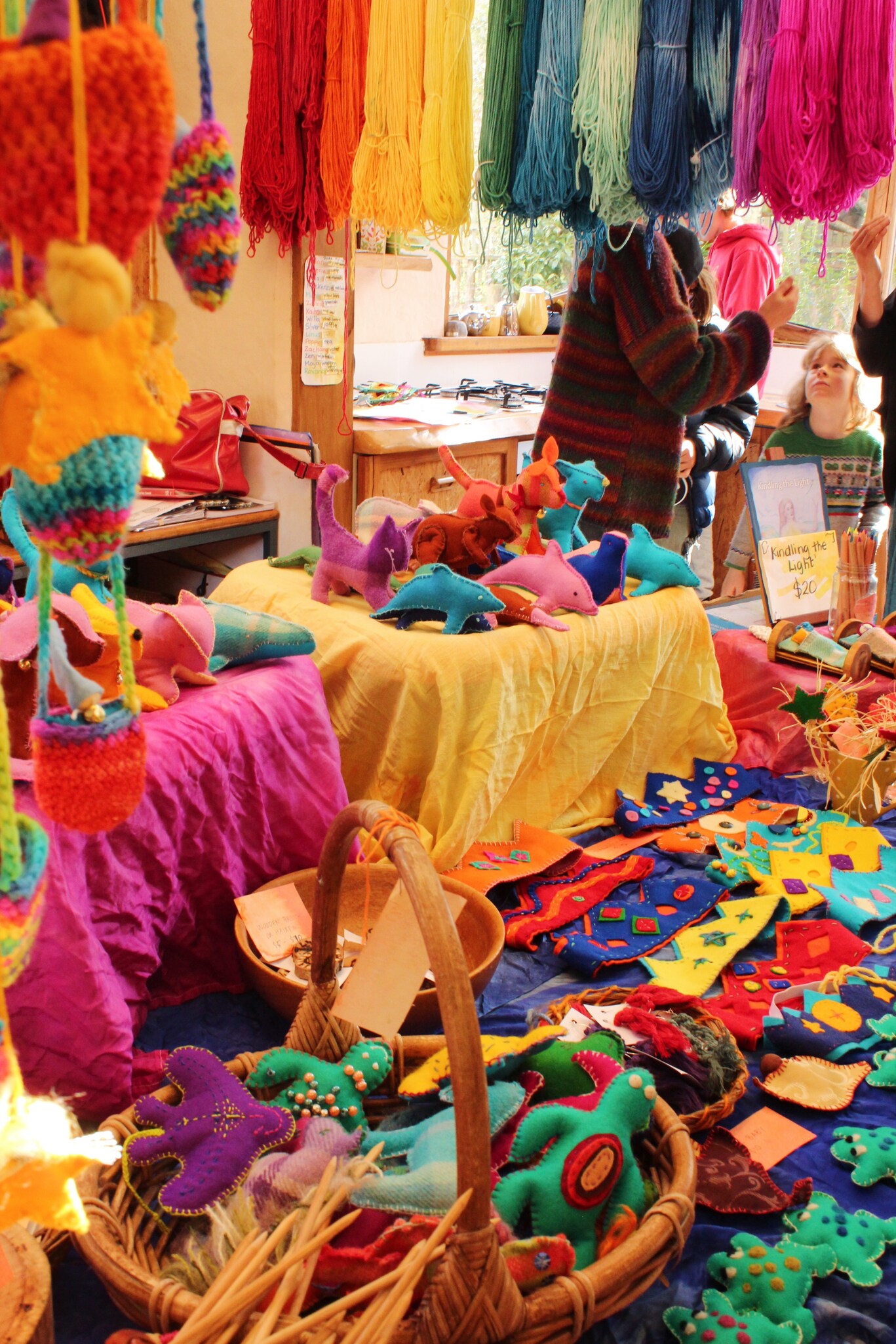 Vibrant handmade crafts and colourful wool celebrate the shared creativity and warm community spirit of the Kindlehill Fair.