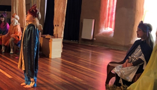 Class 1 children perform Blend Blossom Bloom, expressing their literacy journey through imaginative costumes and confident theatrical storytelling.