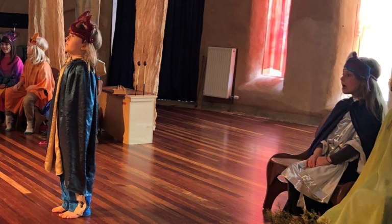 Class 1 children perform Blend Blossom Bloom, expressing their literacy journey through imaginative costumes and confident theatrical storytelling.