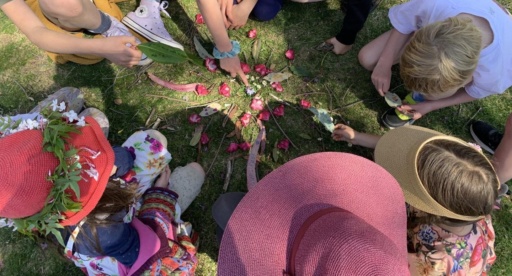Students gather to co-create a spring mandala, honouring natures rhythms and fostering connection through shared community intention.