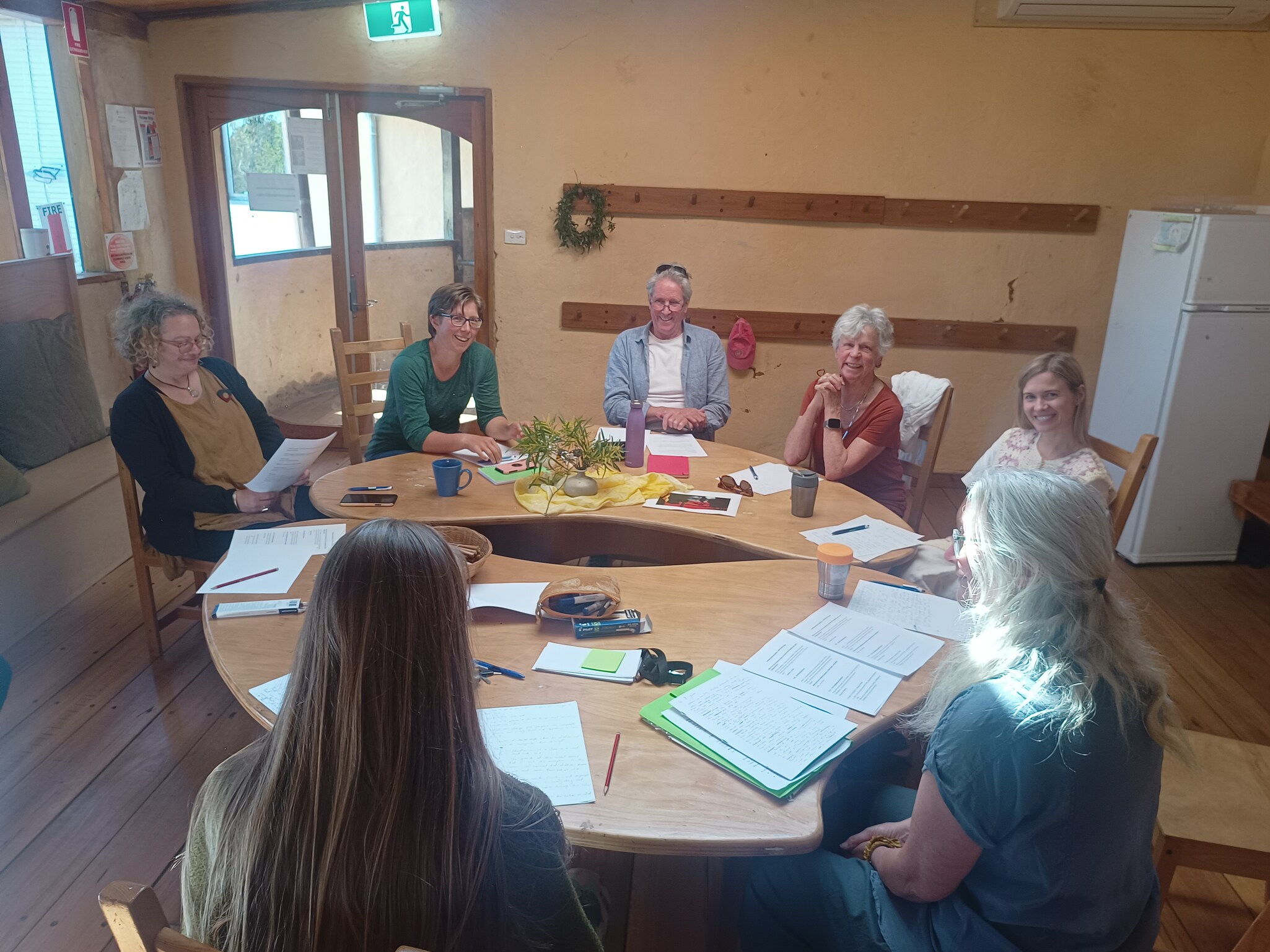 The Kindlehill community collaborates around a shared table, co-authoring a culturally nourishing and resilient vision for the school.