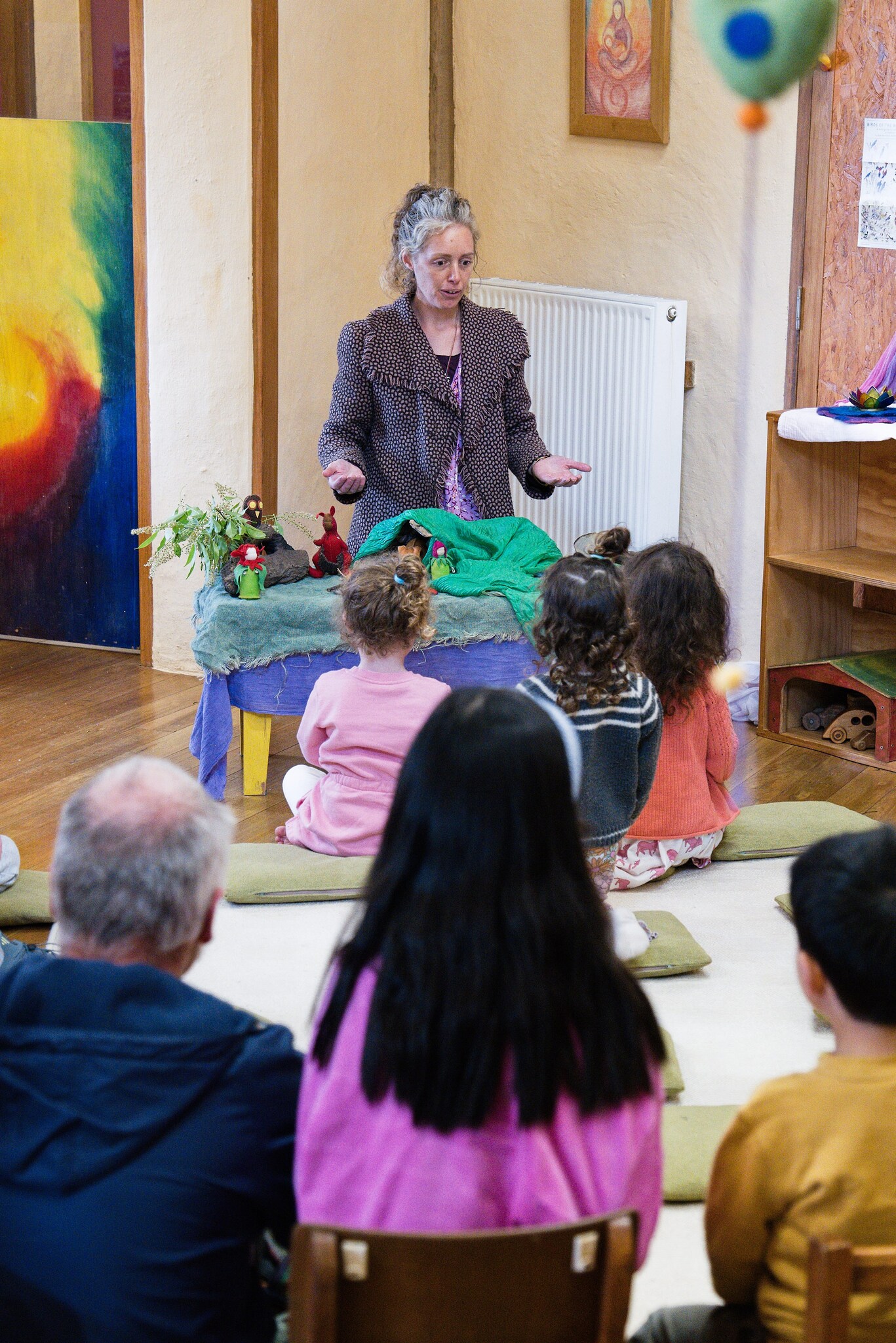 A teacher shares puppet stories, connecting children and families through imagination and Kindlehills warm spirit of community.