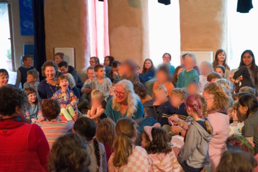 Students and educators gather in a joyful ceremony, honouring community connection and the shared spirit of a village.