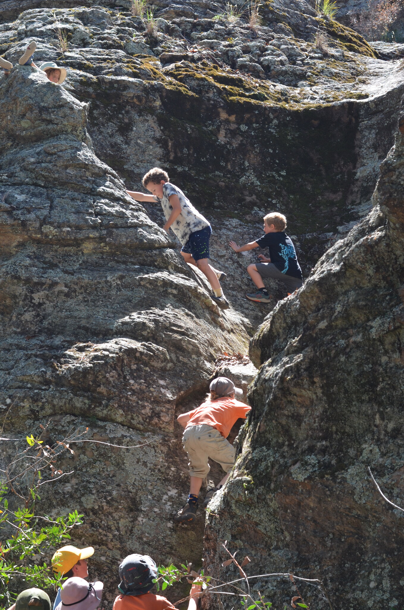 Kindlehill children climb rocky pagodas at Ganguddy, building resilience and independence through adventurous connection with nature and Country.
