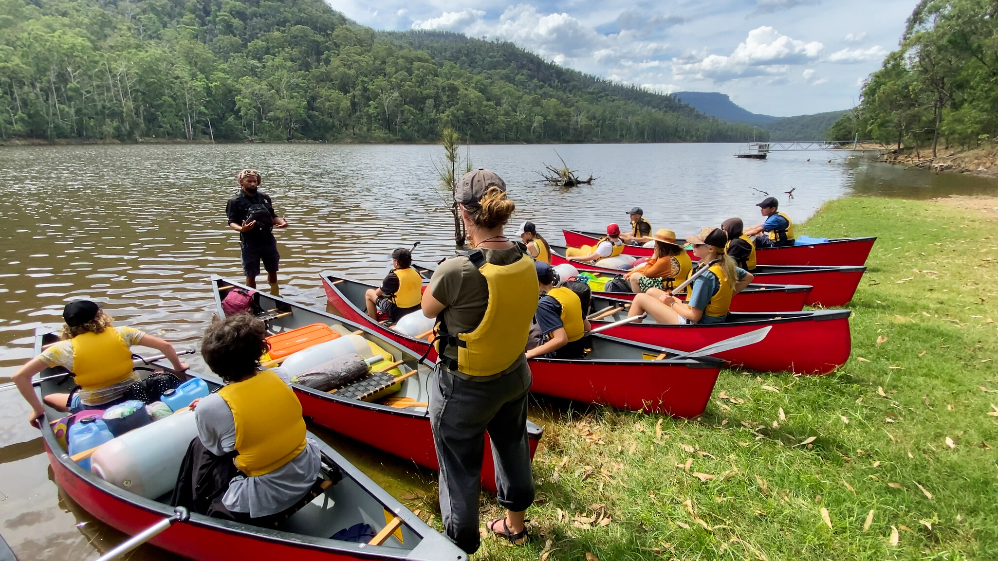 Kindlehill students gather in canoes, listening to their guide as they build resilience and connect with Shoalhaven Country.
