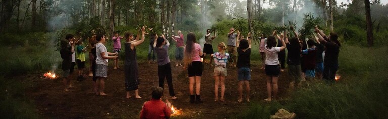 Kindlehill students and parents perform a bush ceremony, honouring Country and fostering a deep sense of community connection.