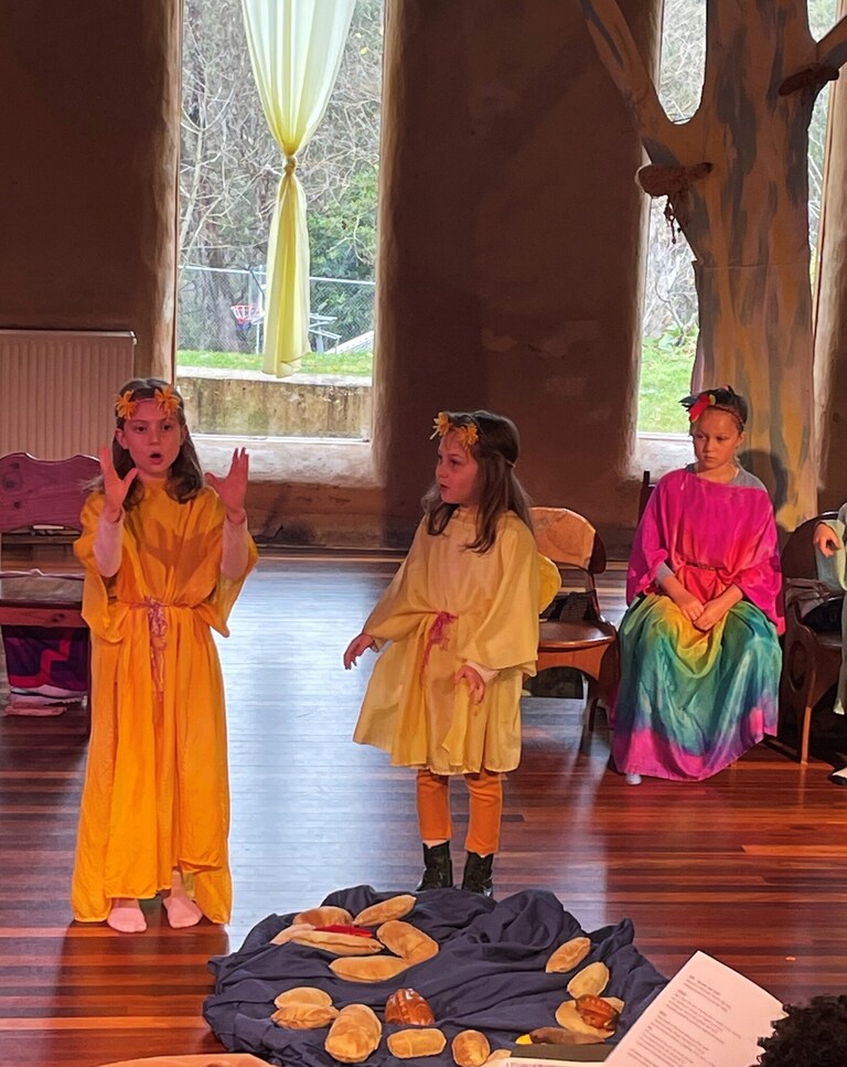 Young storytellers honour the history of the mountains and their inhabitants through song, dance, and colourful performance.