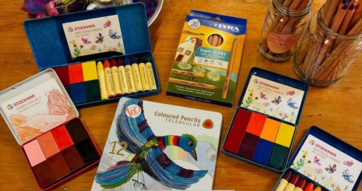 Colourful beeswax crayons and pencils nurture creative expression and communal spirit at the Kindlehill village market.