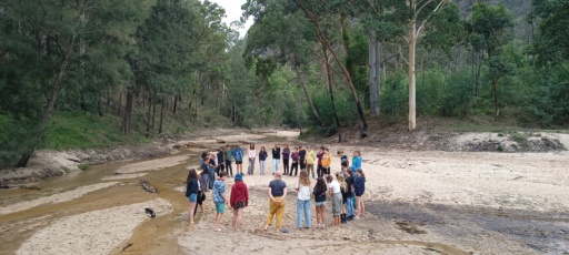 Kindlehill students gather in a circle on Wiradjuri Country, fostering connection and belonging within the vast landscape.