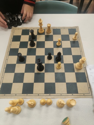 Students foster focus and strategic thinking during an interschool chess match, demonstrating respectful connection and inner discipline.