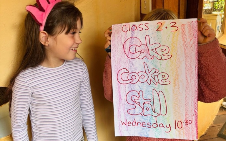 Kindlehill students proudly display a hand-drawn poster, celebrating their social deed for the local animal care centre.