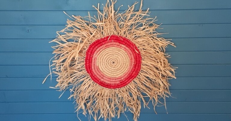 Hand-woven fibre sunburst celebrates Kindlehills respectful connection to Dharug Country, language restoration and vibrant community spirit.