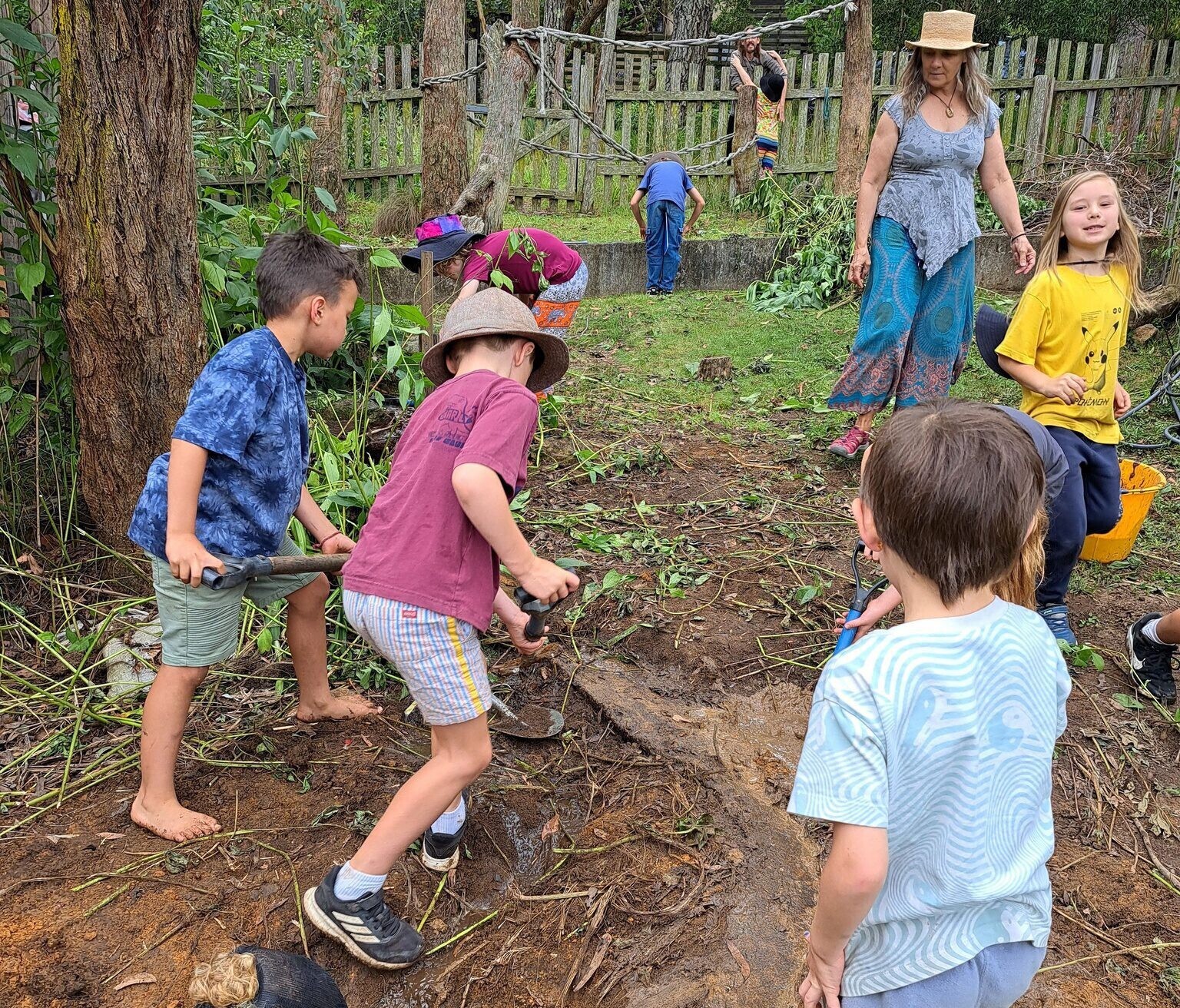 Kindlehill students and educators work together digging soil, connecting to Country through purposeful, earth-centred community action.