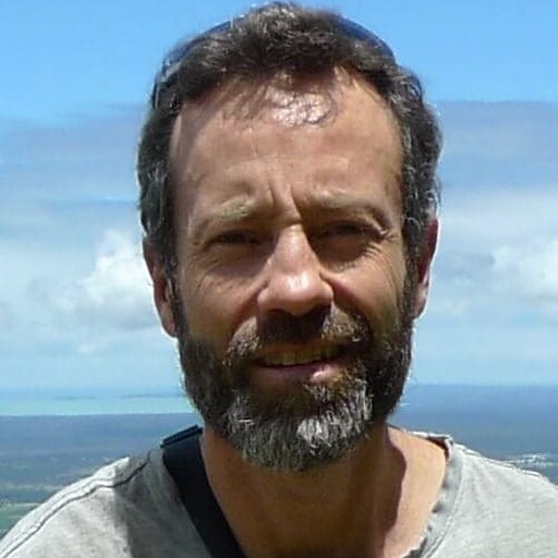 A teacher stands amidst the Blue Mountains, honouring a profound connection with the land and the spirit of community.