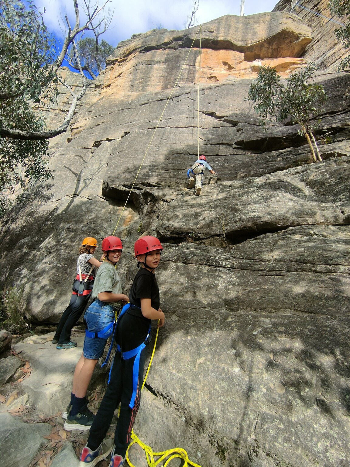 Kindlehill students foster resilience and connection while scaling sandstone cliffs together in the wild Blue Mountains landscape.