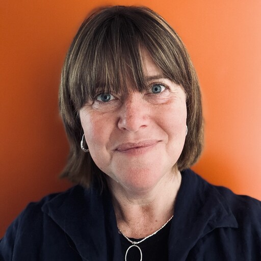 Kindlehill educator radiates warmth and compassion, reflecting a deep connection to community and the heart of our village.