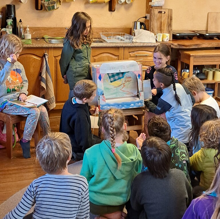 Students awaken imagination and community through collaborative storytelling with a handmade puppet theatre, connecting head, heart, and hands.