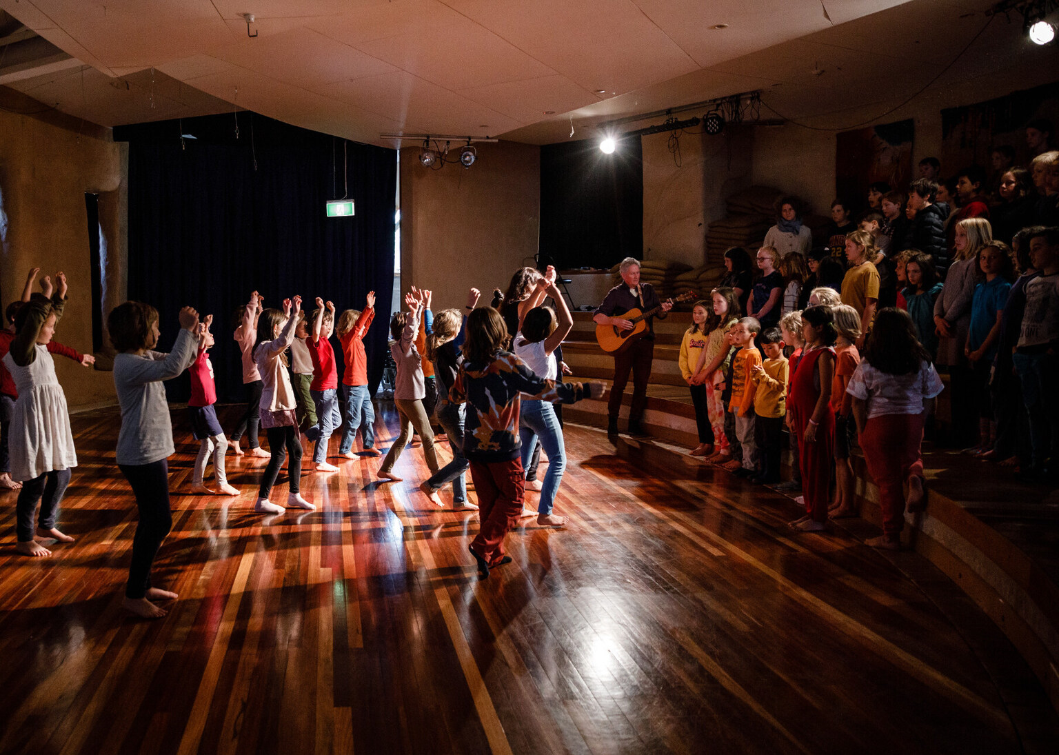 Kindlehill students harmonise through song and dance, celebrating community spirit and wholehearted artistic expression within a shared rhythm.