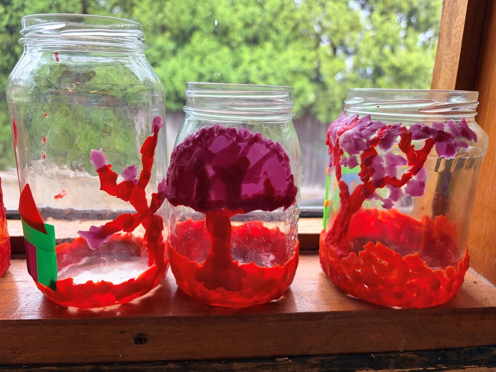 Colourful jars featuring hand-crafted trees celebrate seasonal rhythms and an artistic connection to the natural world.
