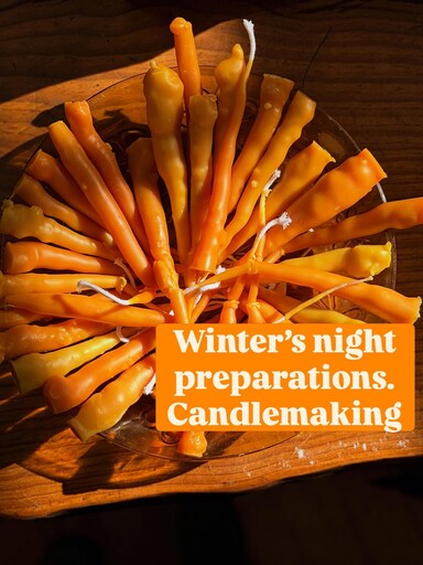 Hand-dipped beeswax candles arranged in a radiant circle honour seasonal rhythms and the communal spirit of winter preparations.