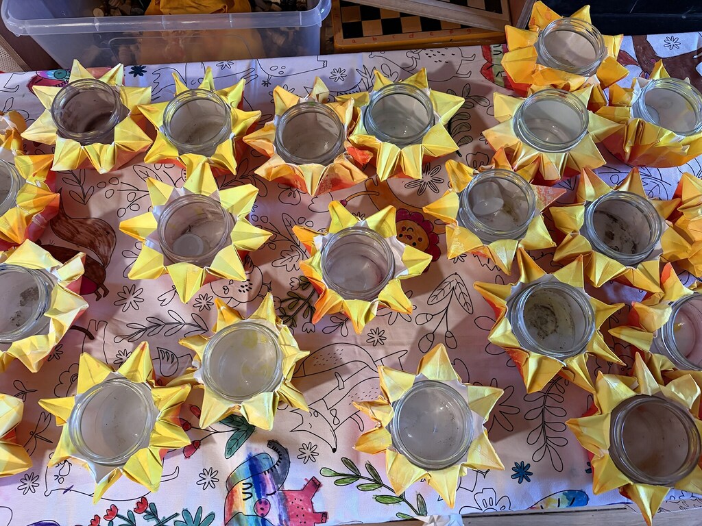 Golden handmade lanterns symbolise the warm community heart, seasonal rhythm, and creative spirit connecting every Kindlehill family.