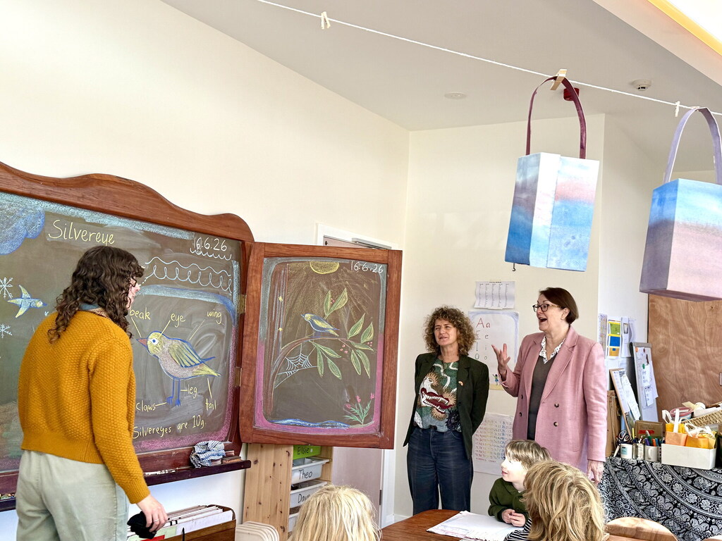Susan Templeman admires artistic chalkboard bird illustrations while celebrating the nature-based, creative community at Kindlehill Steiner School.