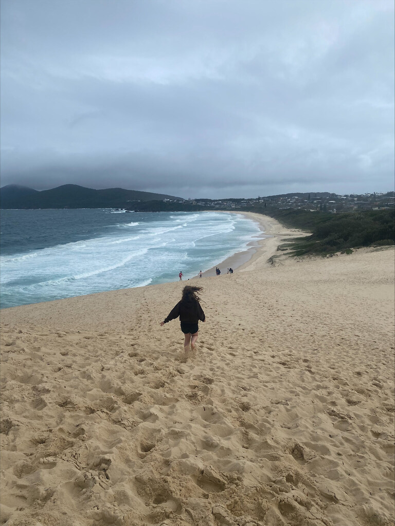 Kindlehill students run down vast dunes toward a wild sea, finishing their resilient mountain-to-sea journey and connecting with Country.